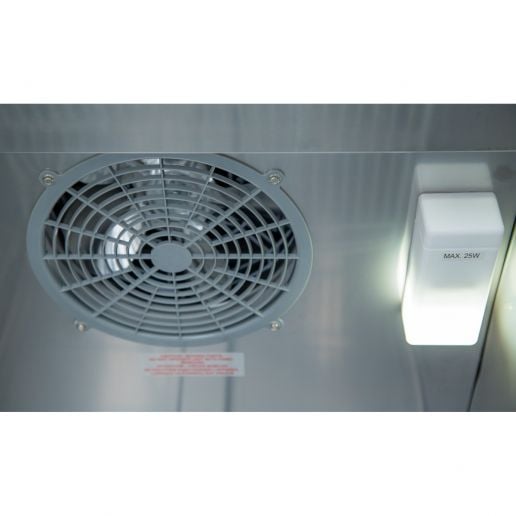 Interior fan and light system of a single door commercial freezer for even cooling