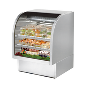 Curved glass deli case showcasing food items in True Refrigeration TCGG-36-S-HC-LD model