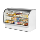 Curved glass refrigerated display case showcasing food and beverages in True Refrigeration model