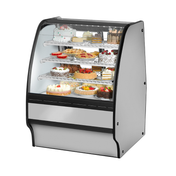 Curved glass refrigerated display case showcasing cakes in True Refrigeration TGM-R-36-SC/SC-S-W